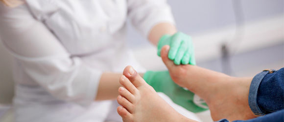 Plantar Wart Clinic - Doctor examining patient's foot for warts - Appletree Medical Group